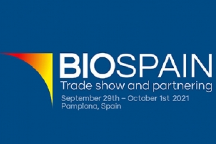 Fotografía del cartel promocional del evento con un fondo azul oscuro y la frase biospain y la fecha en la que se celebrará.